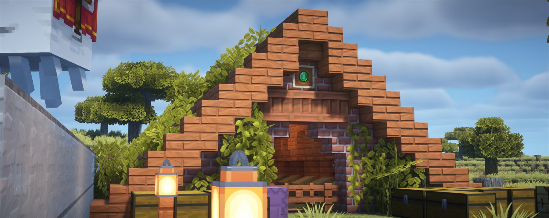 Entrada de madera y piedra decorada con vegetación y faroles